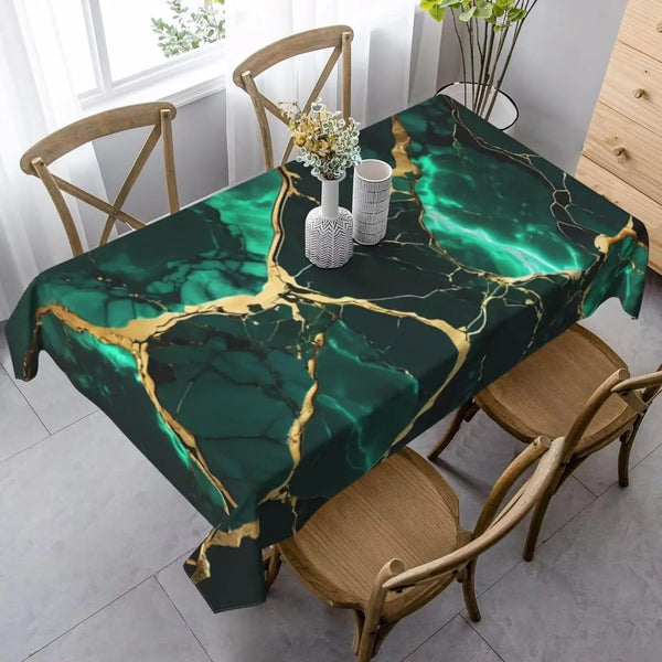 Emerald green marble texture tablecloth set for holiday decor displayed on a wooden dining table.