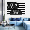 A blue sofa with pillows and a custom photo American flag tapestry featuring stars and stripes.