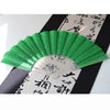 A green glitter folding fan with transparent ribs is displayed against a black background with Japanese calligraphy.