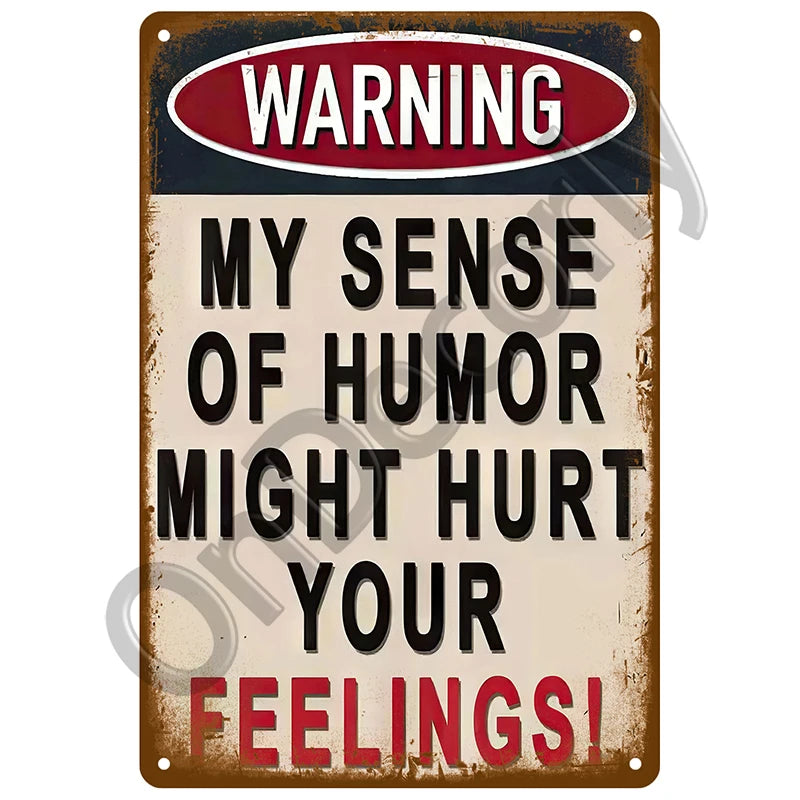 A vintage metal sign with a warning that says My sense of humor might hurt your feelings