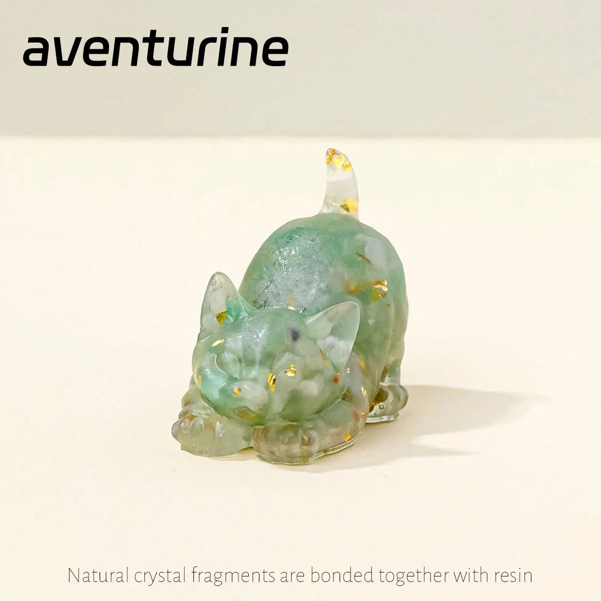 A translucent green crystal cat statue made from natural crystal fragments bonded with resin.