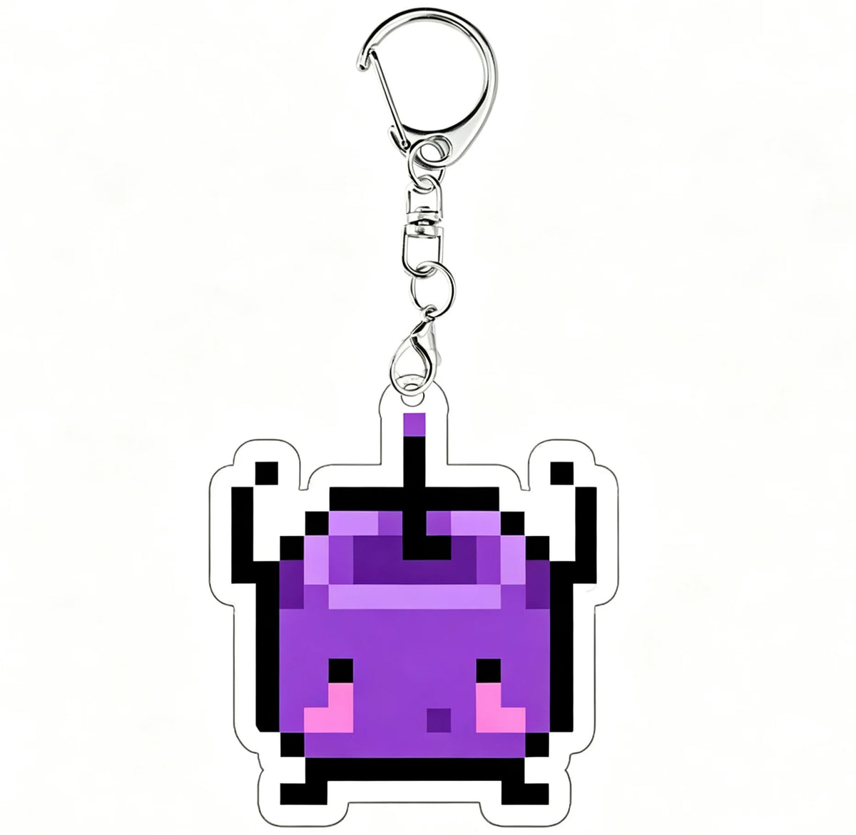 A purple pixel art charm of a Junimo character attached to a silver keychain ring.