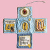 Handcrafted pocket devotional with a cross-shaped pouch featuring blue fabric and gold embroidery.