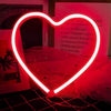A bright red neon heart sign shaped like a butterfly for decoration or gifting