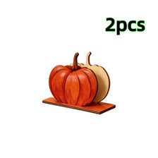 Two wooden pumpkins used as napkin holders for fall and Thanksgiving decor
