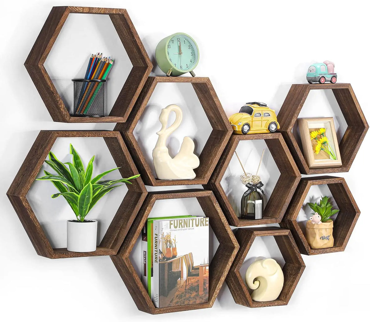 A set of four wooden hexagon floating shelves displaying various decorative items like pencils, a sculpture, and a small toy 