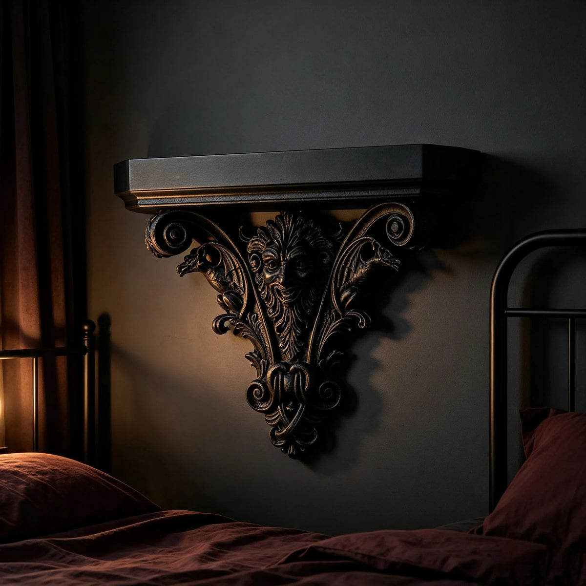 A dark, ornate Gothic wall shelf with intricate carvings mounted on a dark gray wall above a bed.