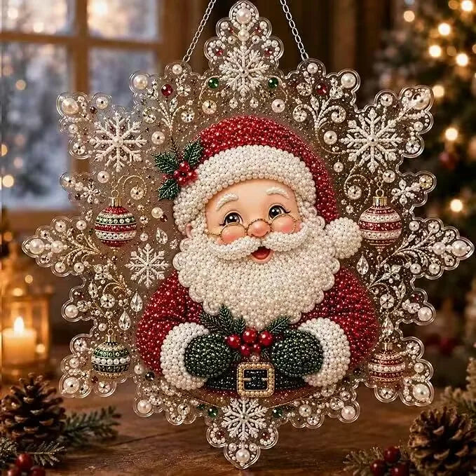 A festive Christmas ornament featuring a depiction of Santa Claus with a white beard, set in a sparkling diamond-like frame.