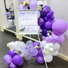 A balloon garland arch kit featuring purple and white balloons arranged in a vertical display.