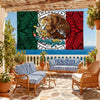 A decorative banner featuring the Mexican flag colors and an eagle design displayed in an outdoor living area.