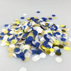 A pile of multicolor paper confetti consisting of gold, silver, and blue circular pieces.