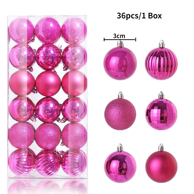 A box containing 36 pink and magenta glitter Christmas tree ornament balls.