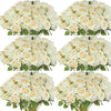 A collection of white and cream velvet artificial roses arranged in bouquets for weddings and home décor.