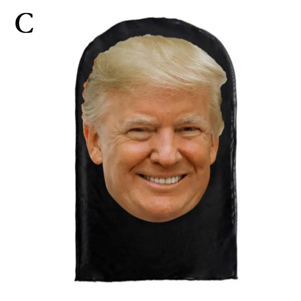 A realistic mask shaped like Donald Trump, featuring his face in a black mesh material.