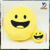 A yellow, smiling plush doll with black features is shown against a white background.