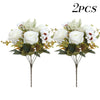 Two bouquets of artificial silk roses and daisies with green foliage
