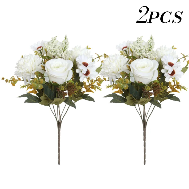 Two bouquets of artificial silk roses and daisies with green foliage