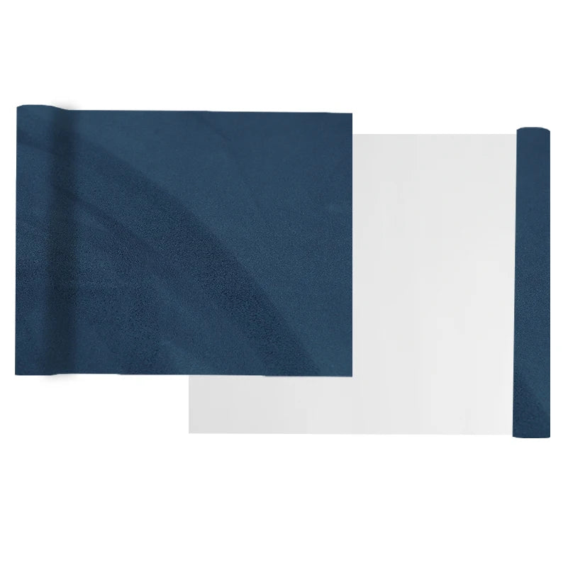 A roll of dark navy suede wrap fabric with a white backing for DIY projects.