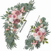 A floral arrangement featuring dusty rose and white roses with pink accents and eucalyptus greenery.