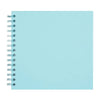 A blank, light blue spiral-bound notebook or scrapbook album.