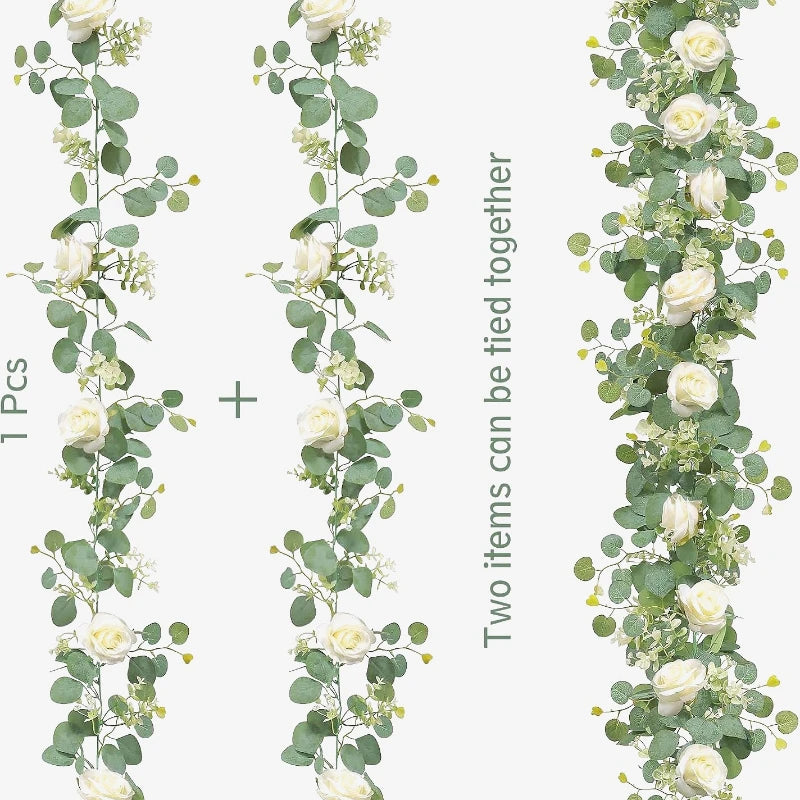 Two artificial eucalyptus garlands with white roses tied together for decor