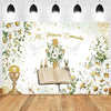 A white backdrop featuring floral and golden accents for a First Communion celebration with a Bible and doves.