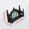 Black ornate Gothic wall shelf featuring intricate carvings and a decorative railing design.