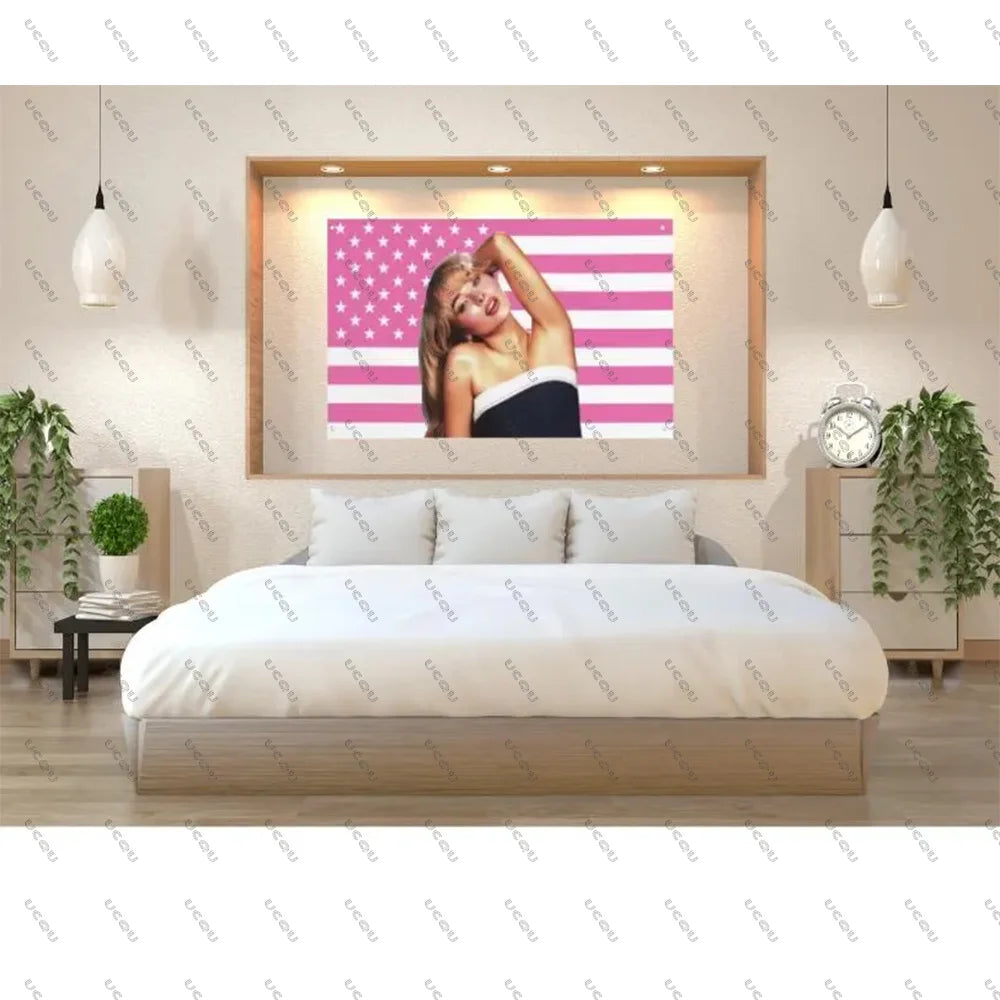 A bedroom decor display featuring a framed tapestry of the American flag with stars and stripes, above a bed.