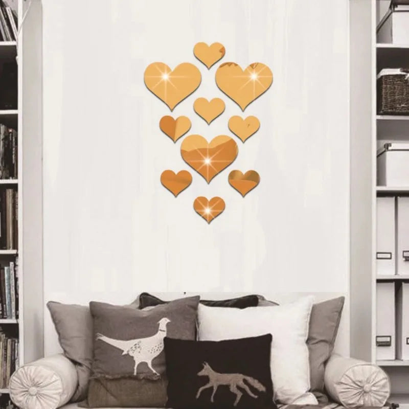 A set of orange and gold heart-shaped 3D acrylic mirror wall stickers displayed on a white background.