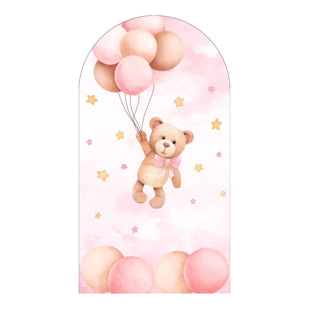 A cute teddy bear is holding balloons in an arched pink backdrop for a baby shower or party decor.