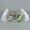 Football birthday cake toppers featuring soccer players and field decor set against a gray background.
