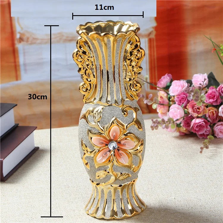 Gold-plated ceramic tabletop vase with ornate design and a central floral motif