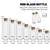 A set of mini glass bottles in various sizes with cork stoppers for storage or craft use.