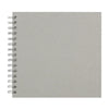 A blank gray spiral-bound notebook or scrapbook album with white pages.