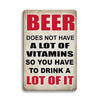 Vintage metal sign with red text that reads Beer does not have a lot of vitamins so you have to drink a lot of it