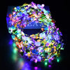 A glowing flower wreath headband made of many small LED lights in various colors.