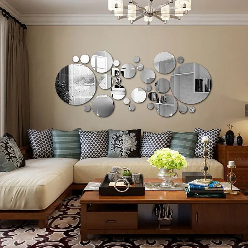 A modern living room featuring a beige wall with a decorative arrangement of round acrylic mirrors.