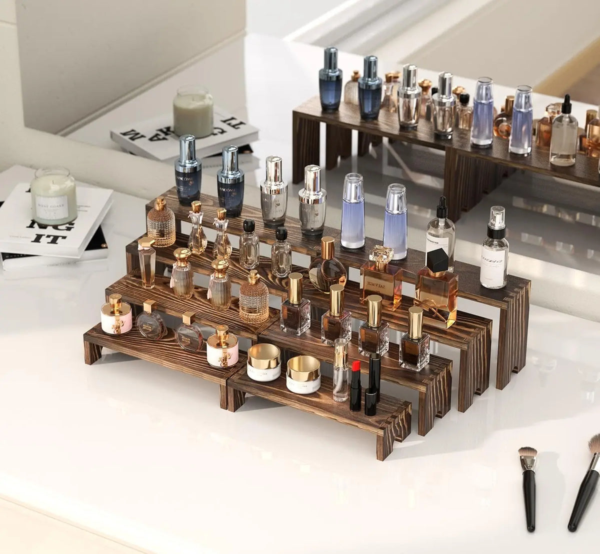 A display of various glass bottles and jars arranged on stacked wooden tiers for event or farmhouse decor.
