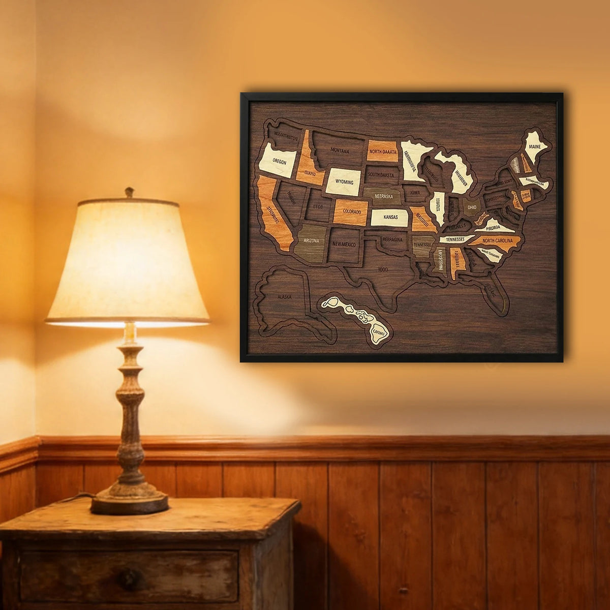 A framed wooden map of the USA showing states with stickers, displayed on a wall above a wooden cabinet.
