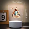 A 3D LED night light featuring a Jesus figure with lambs, displayed on a white base.