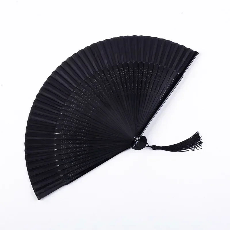 Black traditional Chinese folding fan with fine pleats.
