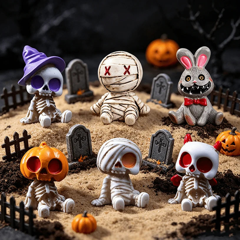 A collection of Halloween resin figurines featuring skeletons, mummies, and rabbits set in a dirt landscape.
