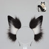A black faux fur fox tail and ear costume set displayed against a light gray background.