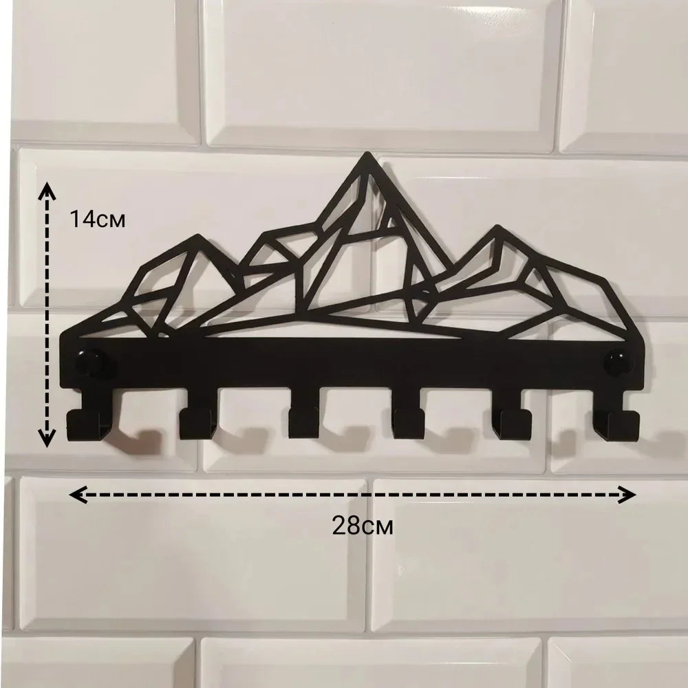 Black industrial iron wall mount key holder featuring a geometric mountain design and seven hooks