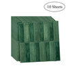 A stack of ten sheets of dark green peel-and-stick waterproof wall tiles for kitchen and bathroom backsplashes.
