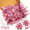 A bouquet of pink artificial berry and flower stems displayed in a box.