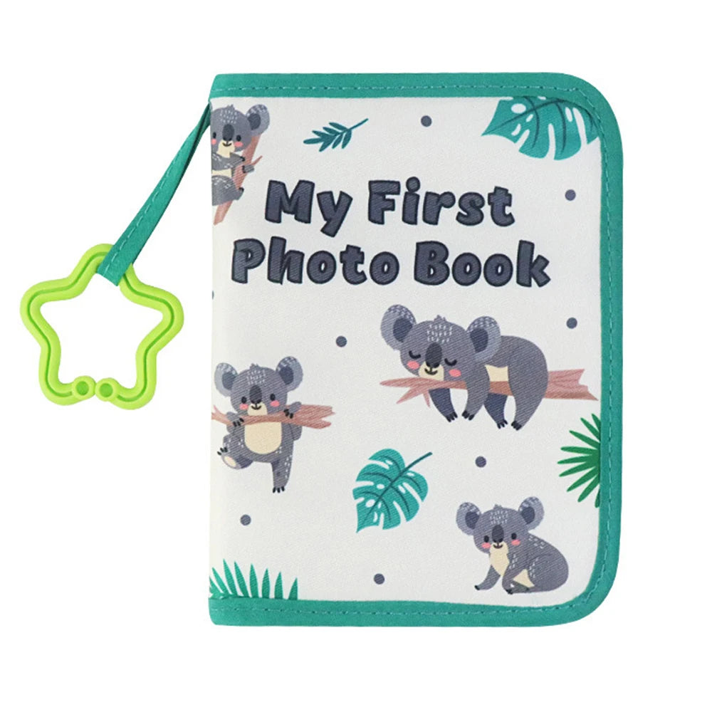A teal silicone photo book featuring a pattern of cute gray koala illustrations and the text My First Photo Book.