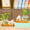 Mini resin desk ornament featuring a green ivy plant and a white lucky cat in a clear glass vase