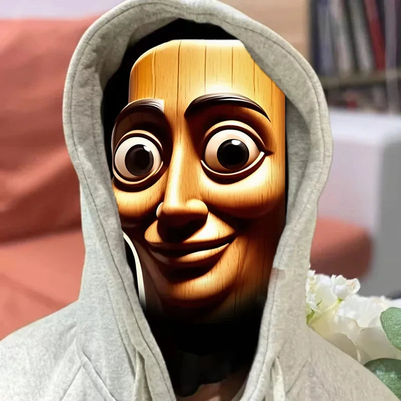 A 3D printed novelty face mask resembling a wooden or carved face, shown in a hoodie context.