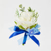 A blue ribbon bouquet featuring a white silk rose and light blue filler flowers.